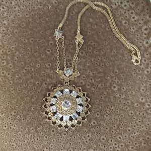 Goldtone flower pendant necklace with rhinestones